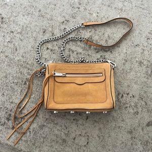 Rebecca Minkoff orangish beige bag with silver chain. Small stains on back.